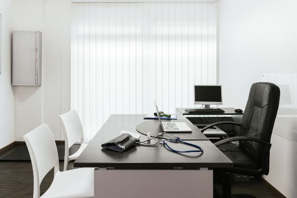 Portland OR office with white blinds letting in natural light